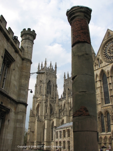 Roman Column in York, which was originally part of the Basilica. It was found under York Minster, in the background